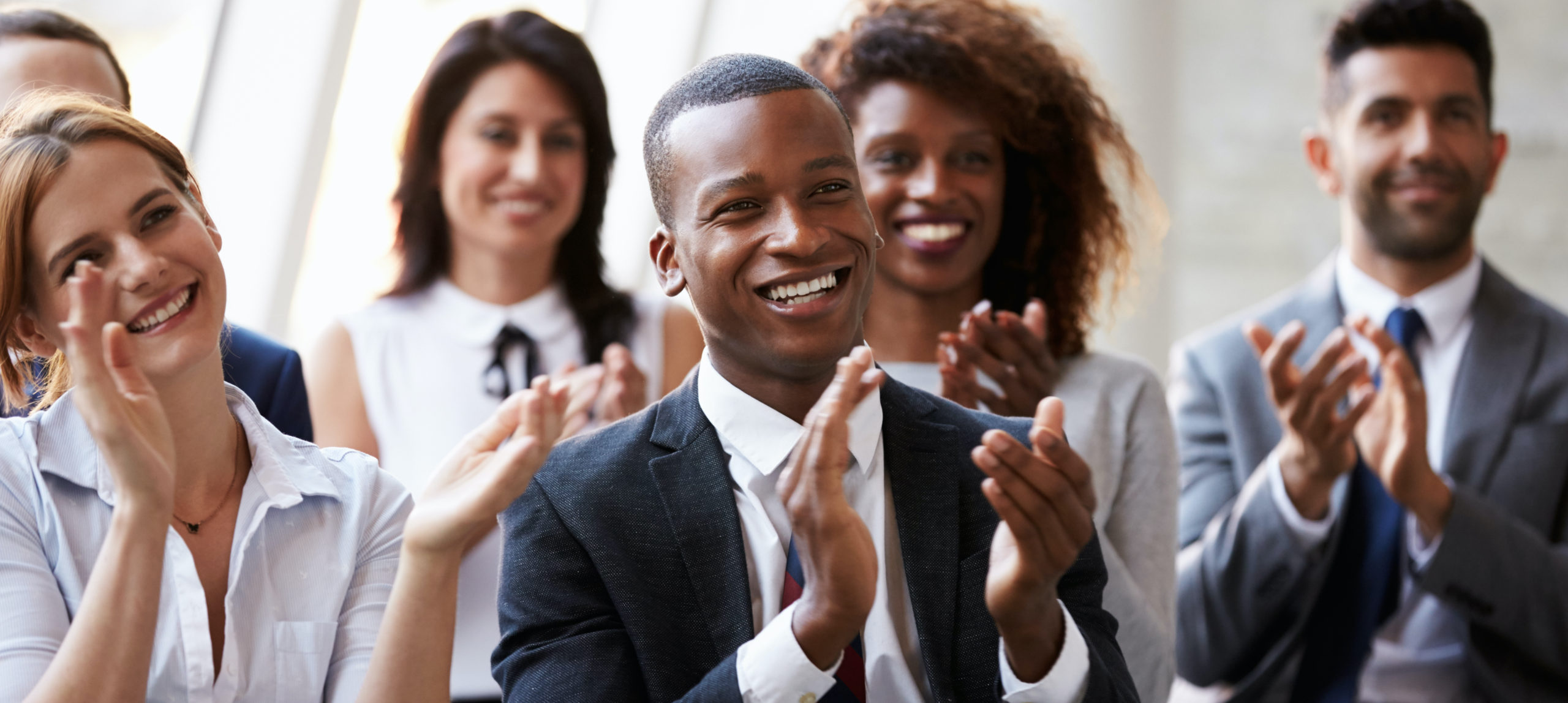 Group of employees applauding